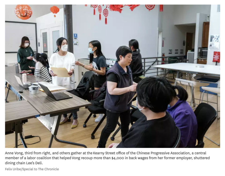 Anne Vong, third from right, and others gather at the Kearny Street office of the Chinese Progressive Association, a central member of a labor coalition that helped Vong recoup more than $4,000 in back wages from her former employer, shuttered dining chain Lee’s Deli.